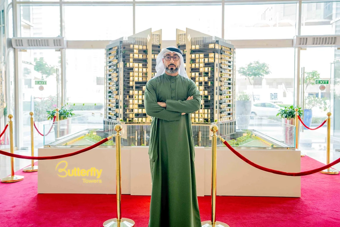 Marwan Al Sayyah, CEO of Al Sayyah Group, showcasing a model of the Butterfly Towers Al Sayyah Group announces Dhs350 million Butterfly Towers in Arjan